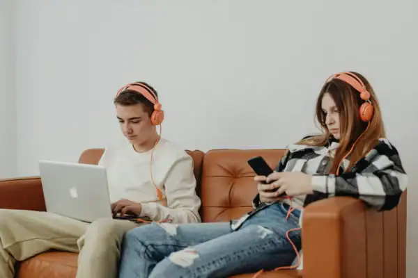 Teens using audiobooks to improve reading fluency.